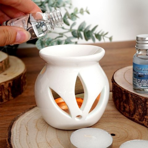 Kominek ceramiczny z olejkami zapachowymi i świecami tealight zestaw 15 szt. Kominek ceramiczny z olejkami zapachowymi i świecami tealight zestaw 15 szt.