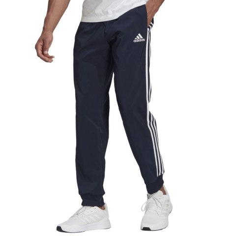 Spodnie adidas Essentials Tapered Cuff 3 Stripes Pants M GK8981 Spodnie adidas Essentials Tapered Cuff 3 Stripes Pants M GK8981