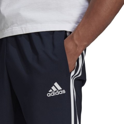 Spodnie adidas Essentials Tapered Cuff 3 Stripes Pants M GK8981 Spodnie adidas Essentials Tapered Cuff 3 Stripes Pants M GK8981