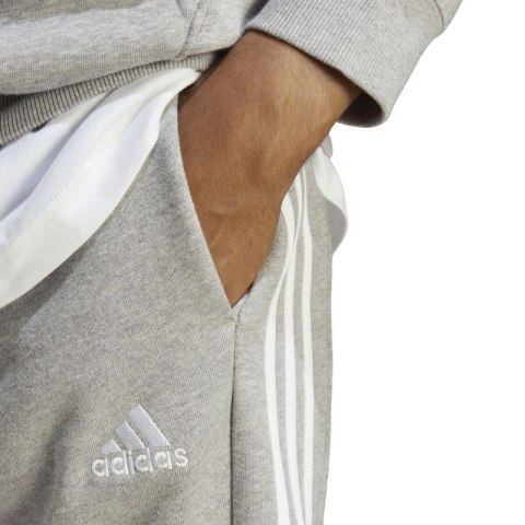 Spodnie adidas Essentials French Terry Tapered Cuff 3-Stripes M IC9407 Spodnie adidas Essentials French Terry Tapered Cuff 3-Stripes M IC9407